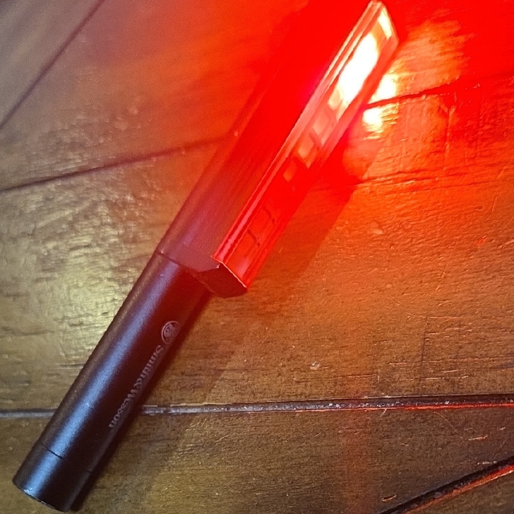 Smith & WessonBlack and Red Electronic Device